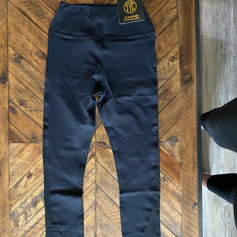 Black workout pants with mesh detail